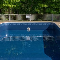 In ground swimming poolwith new vinyl liner being refilled with water ready for use